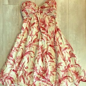 Strapless pink toile print dress.